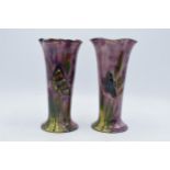A pair of studio artist's vases depicting butterflies amongst foliage (2). 20cm tall. In good
