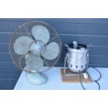 A pair of items to include a vintage large industrial fan and a stage light which has been converted