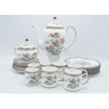 A collection of Wedgwood Kutani Crane pottery to include a coffee pot, lidded sugar, 3 small