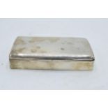 A silver cigarette box with wooden lining. 14 x 8 x 3cm. In clean condition with some scratches