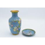 A 20th century Japanese cloisonné vase and matching stand decorated with a floral design on a blue