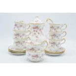 A Paragon coffee set in the Victoriana Rose design to include a coffee pot, 6 coffee cups, 6 saucers