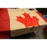 A large 1960s / 1970s Canadian national flag made from cloth with eyelets to hang it. Approx 222cm x