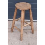 A 19th century wooden farmhouse stool. 69cm tall. In good sturdy condition.