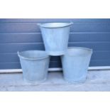 A trio of vintage galvanised tin buckets with 2 riveted examples (3). 36cm tallest.