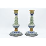 A pair of Doulton Lambeth candlesticks, circa 1880, with artist's monograms to base to include