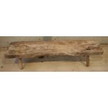 A 19th century thick plank pig stool / table on 4 pin legs. 162 x 39 x 34cm tall. Requires some