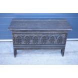 A late 18th / early 19th century carved coffer with religious cross detail to each end panel and