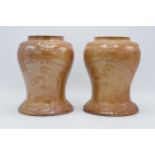 An unusual pair of 19th century salt glazed stoneware baluster shaped snuff jars depicting a