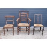 A collection of 19th century and similar aged rush-seated chairs to include an armchair example (