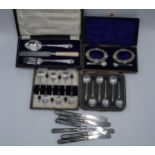 A collection of cased silver plated items to include a pair of salts with blue liners and hallmarked