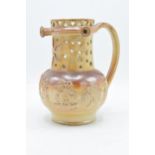 A 19th century Nottingham brown stoneware puzzle jug of traditional form with pierced decoration