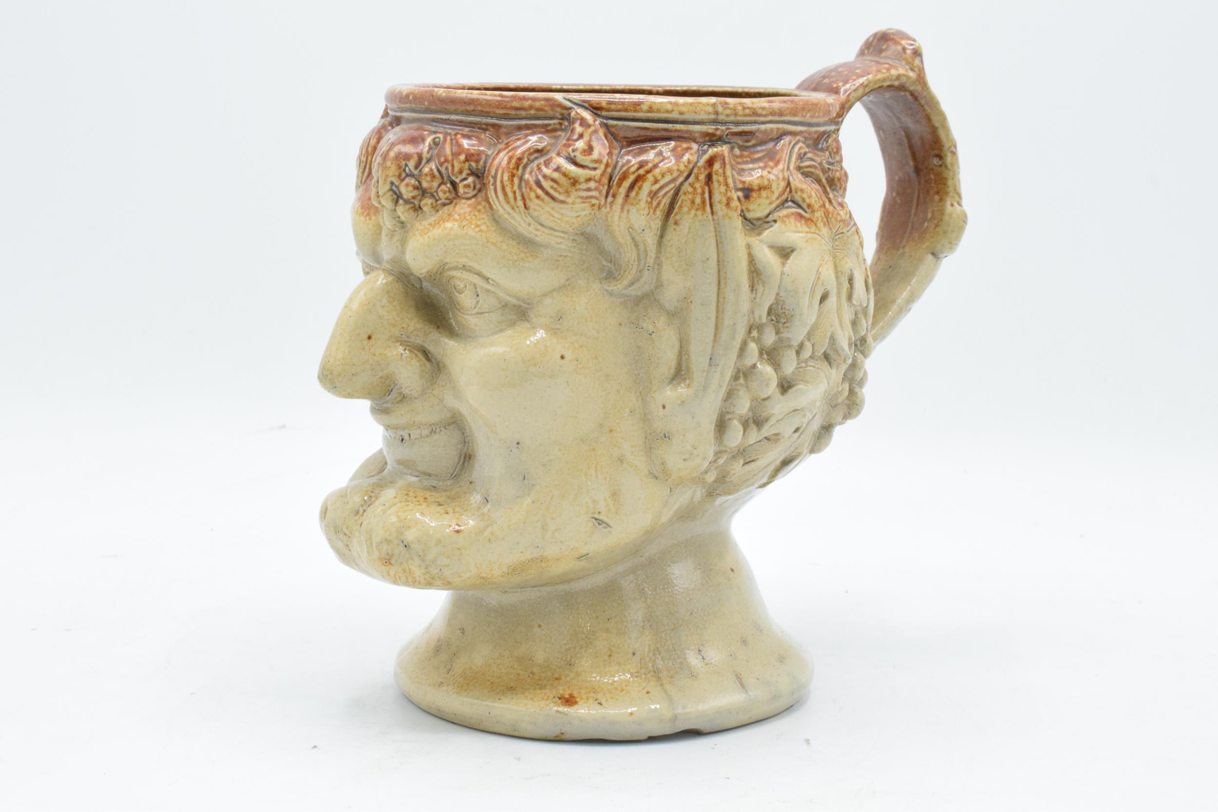 A 19th century stoneware character jug in the form of Bacchus. 19cm tall. Generally in good - Image 2 of 10