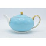 Wedgwood teapot decorated with a light blue and gilded design. In good condition with no obvious