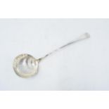 An antique silver ladle with shell decoration. 134.5 grams. Hallmarks rubbed.