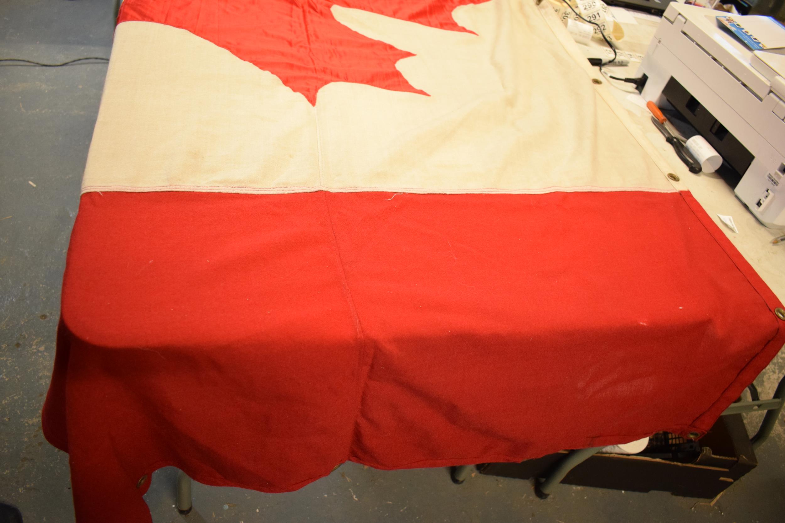 A large 1960s / 1970s Canadian national flag made from cloth with eyelets to hang it. Approx 222cm x - Image 3 of 4