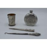 A mixed collection of items to include a pewter hipflask, chrome-plated collapsible cup, paper knife