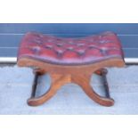 Reproduction mahogany framed upholstered button back Chesterfield style foot stool. 70cm wide. In