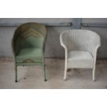 A near pair of Lloyd Loom chairs in white and green colours together with a linen basket with