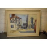 A framed watercolour of a street scene signed by K V Hutchinson. 64 x 52cm inc frame.