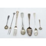 A collection of silver cutlery to include an olive fork, condiment spoons, a tea spoon etc to