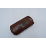 19th century leather cigar case with crest decoration. 12.5cm tall.