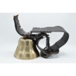 A large 19th century brass cow bell with leather collar and metal buckle, presumed to be of Alpine /