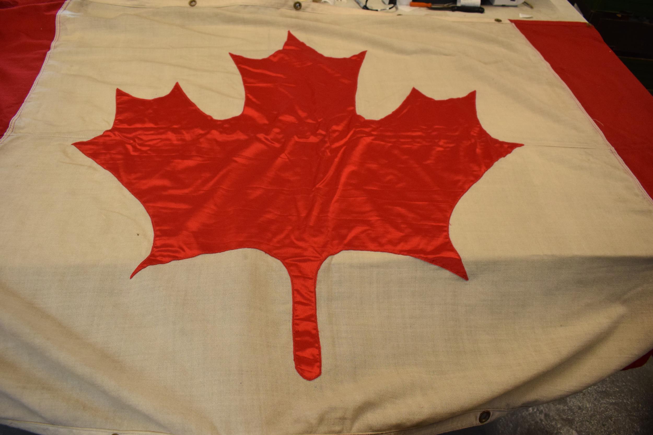 A large 1960s / 1970s Canadian national flag made from cloth with eyelets to hang it. Approx 222cm x - Image 2 of 4