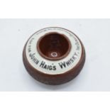 An advertising match striker and holder for John Haig's Whisky. Generally in good condition with