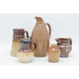 A collection of 19th century stoneware items with traditional scenes to include two-tone examples