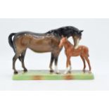 Beswick Mare and Foal on base: Beswick brown mare with Chestnut foal on ceramic grass base 1811.