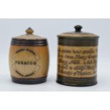 A pair of Doulton Lambeth tobacco jars, one with 'Tobacco' to the front and another with a motto '