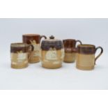 A collection of Royal Doulton and Doulton Lambeth stoneware to include a tobacco jar, a tankard
