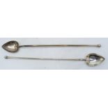 A pair of silver cocktail stirring spoons with elongated handle with ball finial and heart-shaped