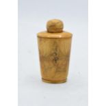 An Asian bone snuff bottle with engraved erotic scenes. 9cm tall.