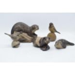 A collection of Poole Pottery stoneware-effect animals to include an otter, a seal, a guinea pig and