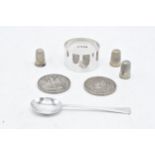 A collection of silver items to include an 1845 crown, an 1889 crown, a napkin ring (Birm 1945), a