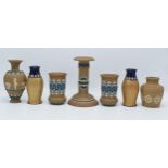 A collection of Doulton Lambeth Silicon ware items to include vases, a candle stick, snuff pot and a