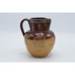 Doulton Lambeth two-tone stoneware jug with traditional scenes with silver rim. H 14cm. In good