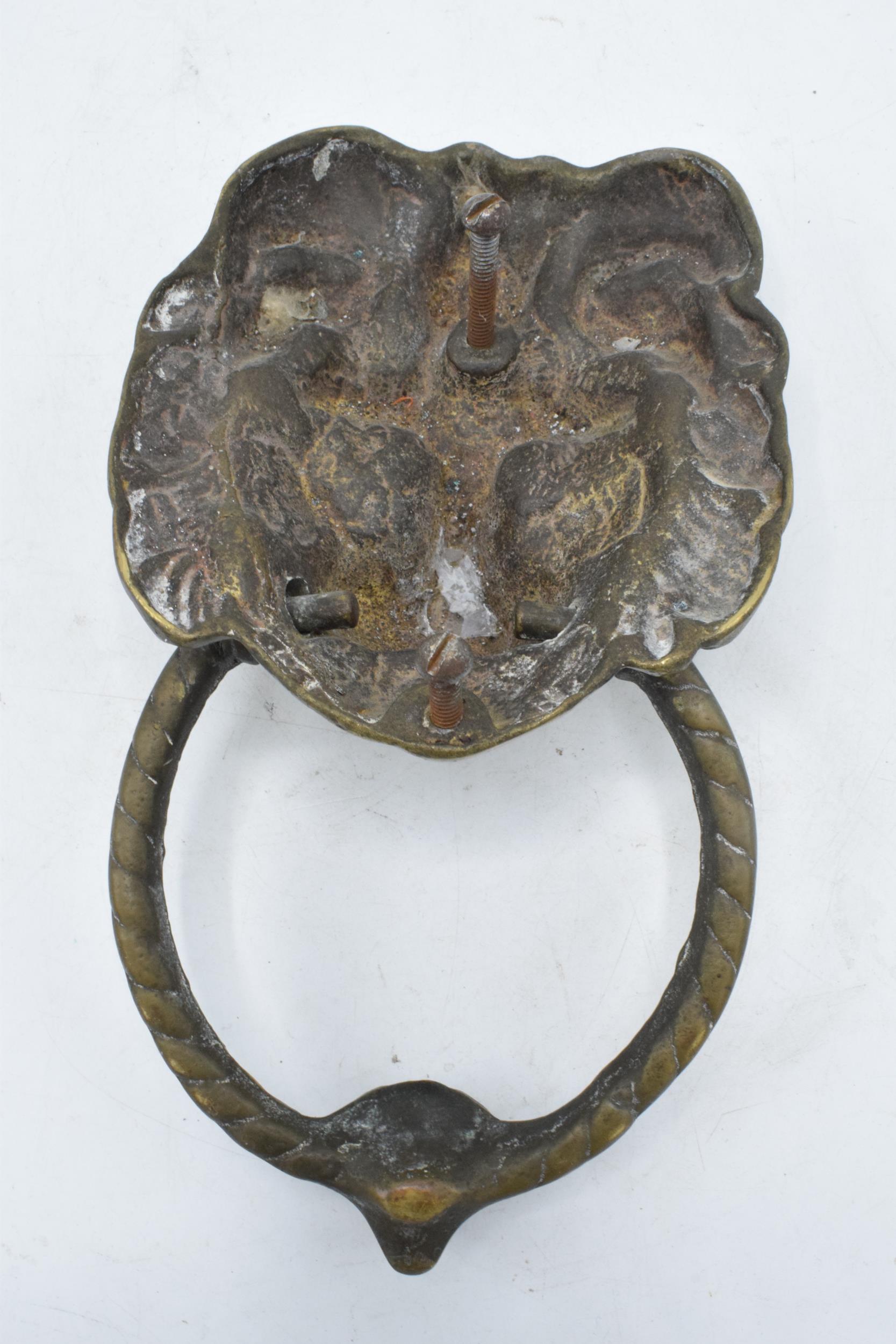 Antique cast brass door knocker in the form of a lion's head. 21cm long including hoop. - Image 2 of 2