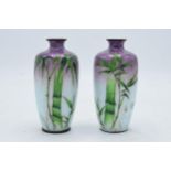 A pair of Japanese cloisonne vase in a purple and silver colourway with green foliage decoration.