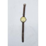 A mid 1920s silver cased watch on leather strap. In ticking order though untested for a period of