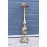 An early 20th century North African brass lamp base with inlaid decoration. 76cm tall. Untested.