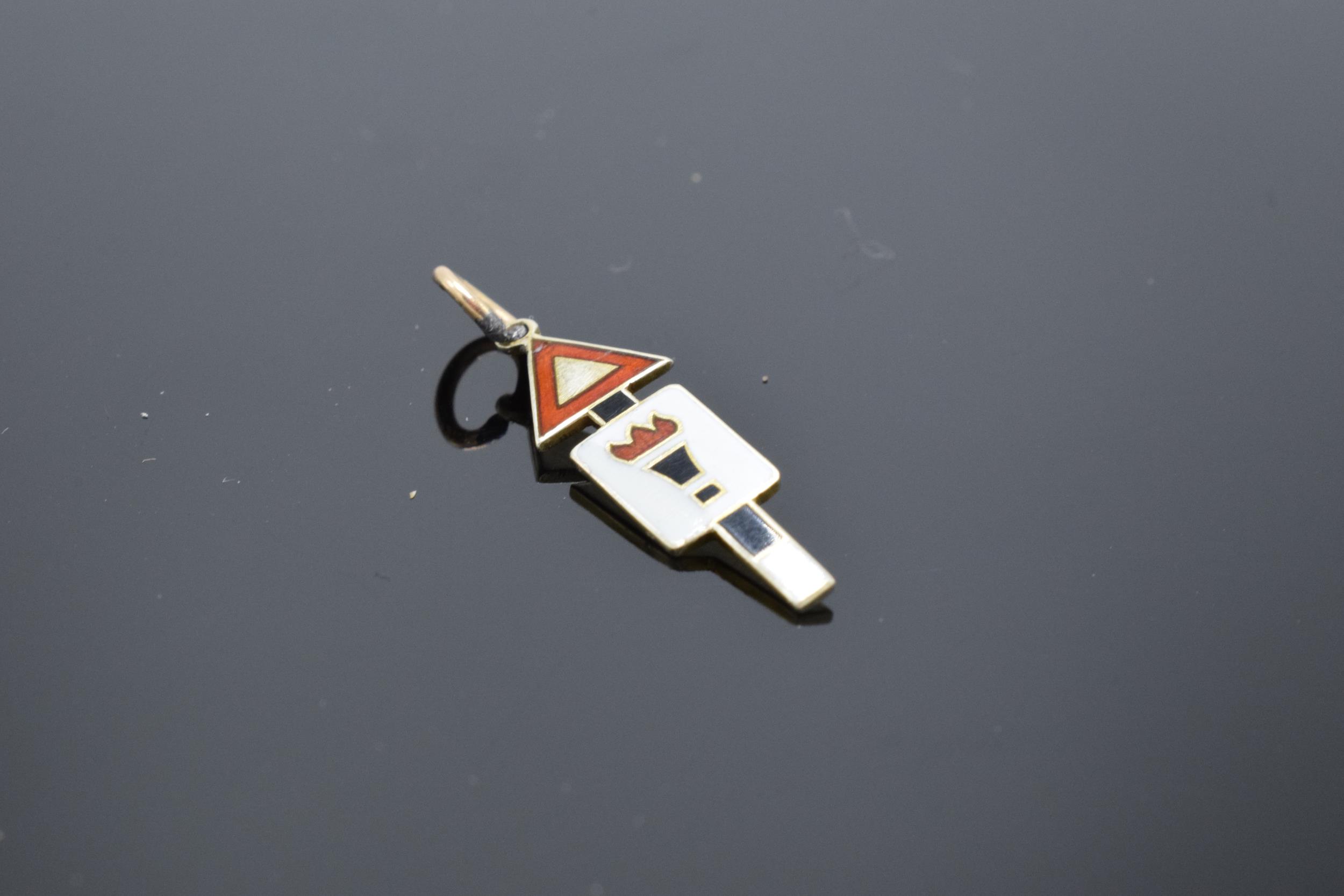 9ct gold enamelled road sign charm 'Torch of Knowledge'. 2cm long. - Image 2 of 3