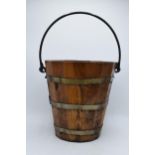 A vintage French 20th century wooden pale / bucket with metal rings. 52cm tall when handle lifted.