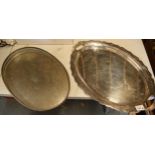 A silver plate on copper oval gallery tray together with a two-handled oval shaped-edge tray (2).