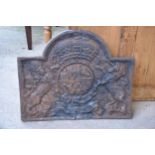 A large antique cast iron domed fireback depicting the coat of arms of Charles I. Approx 100 x 79