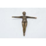 A small antique bronze figure of an outstretched lady. 12cm long.