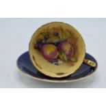 Aynsley blue cup and saucer decorated wit Orchard Gold decoration (2). Signed D James. In good