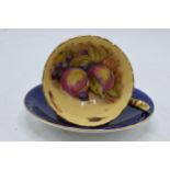 Aynsley blue cup and saucer decorated wit Orchard Gold decoration (2). Signed D James. In good